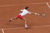 Serbia's Novak Djokovic plays a return to Italy's Lorenzo Musetti during their fourth round match on day 9, of the French Open tennis tournament at Roland Garros in Paris, France, Monday, June 7, 2021. (AP Photo/Michel Euler)