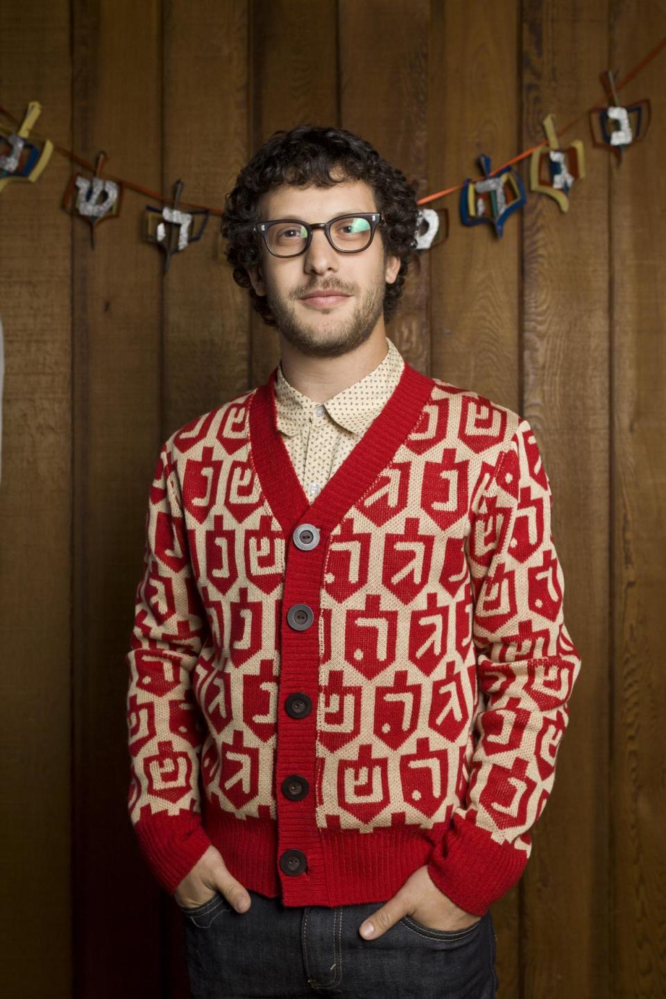 This product image released by GeltFiend.com shows a holiday sweater decorated in a menorah print. (AP Photo/GeltFiend.com)