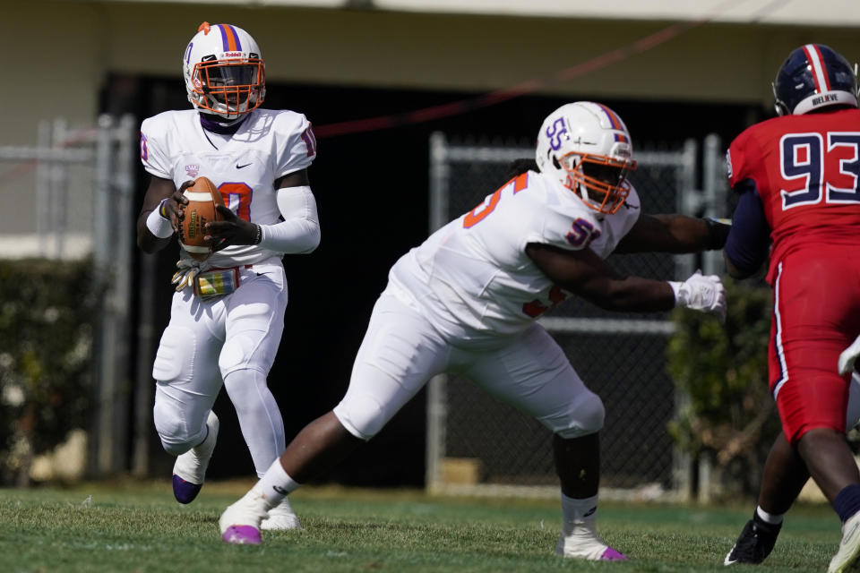 Edward Waters quarterback Roshard Branch (10) drops back to pass against Jackson State during the first half of an NCAA college football game in Jackson, Miss., Sunday, Feb. 21, 2021. The game marks Sanders's collegiate head coaching debut. (AP Photo/Rogelio V. Solis)