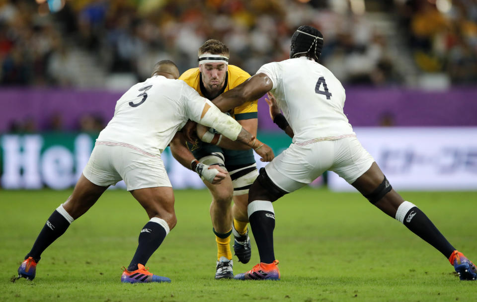 Australia's Izack Rodda is tackled by England's Maro Itoje, right, and Kyle Sinckler, left, during the Rugby World Cup quarterfinal match at Oita Stadium in Oita, Japan, Saturday, Oct. 19, 2019. (AP Photo/Christophe Ena)