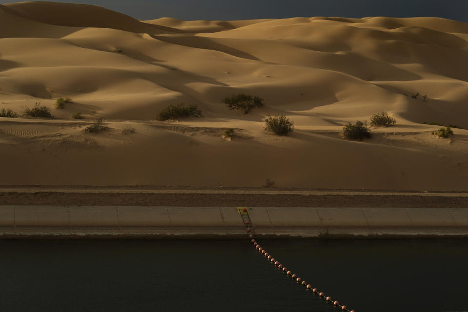 Water flows along the All-American Canal Saturday, Aug. 13, 2022, near Winterhaven, Calif. The canal conveys water from the Colorado River into the Imperial Valley. (AP Photo/Gregory Bull)