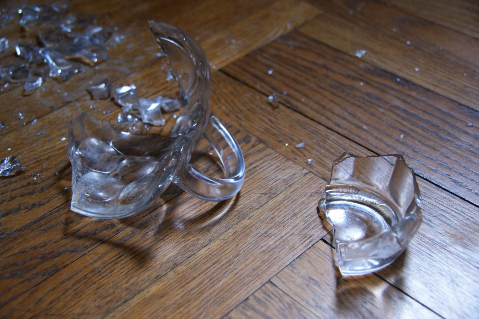 Broken glass cup on floor