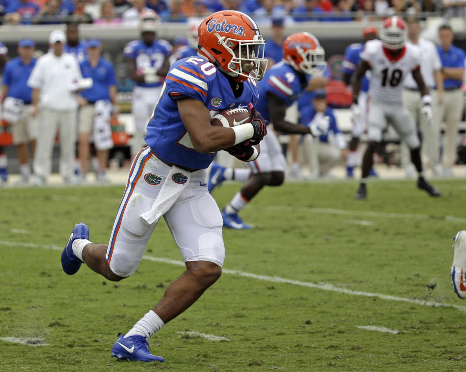 Florida running back Malik Davis (20) runs against Georgia in the first half of an NCAA college football game, Saturday, Oct. 28, 2017, in Jacksonville, Fla. (AP Photo/John Raoux)