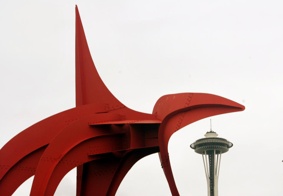 FILE - This Jan. 18, 2007 file photo shows the 39-foot-tall "Eagle" sculpture by Alexander Calder next to the Space Needle at the Olympic Sculpture Park, in Seattle. The Seattle Art Museum opened the art park on the downtown waterfront in 2007 bringing a free cultural experience to visitors. (AP Photo/Elaine Thompson, file)