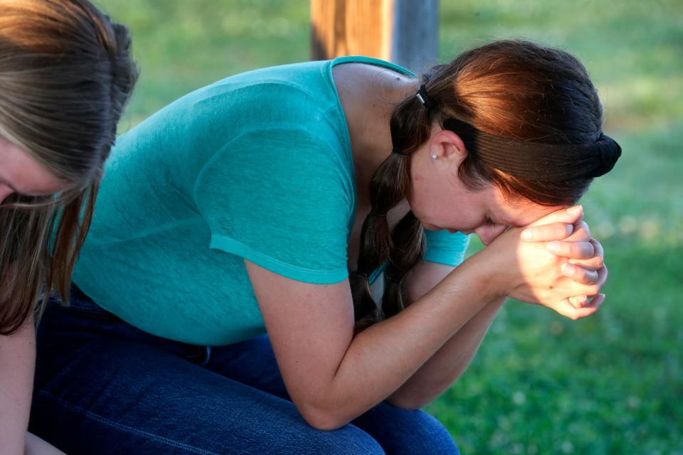 Jessica Hood bows her head in prayer during a Rockvale Memorial Prayer Vigil on Monday, May, 2024, for Asher Sullivan the son of Director of Schools at Rutherford County Schools James “Jimmy” Sullivan, who was injured after a recent storm.