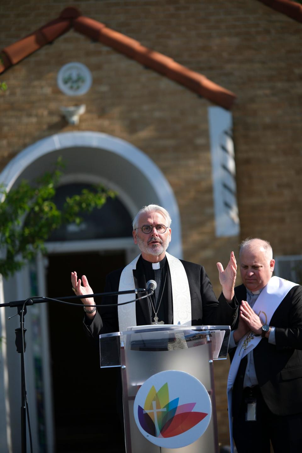 Archbishop Paul S. Coakley provides the invocation and site blessing Tuesday at the groundbreaking ceremony for the new Catholic Charities Sanctuary Women's Development Center.