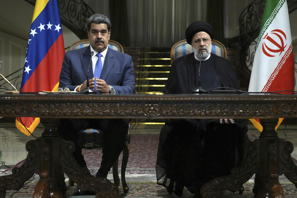 Iranian President Ebrahim Raisi, right, speaks in a joint news briefing with his Venezuelan counterpart Nicolas Maduro at the Saadabad Palace in Tehran, Iran, Saturday, June 11, 2022. (AP Photo/Vahid Salemi)