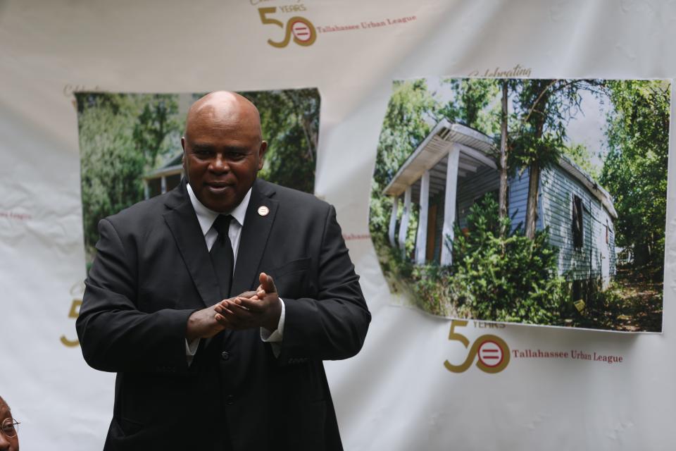 Tallahassee Urban League Interim President and CEO Curtis Taylor leads a ceremony held to unveil the organizations 1000th rehabilitated home, located on Delaware Street, belonging to Henry Murphy Jr. Thursday, Nov. 7, 2019. 