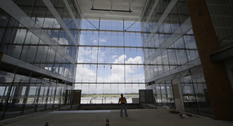 In this photo made Friday, June 3, 2016, work continues on offices at the new Dallas Cowboys headquarters in Frisco, Texas. The development, named The Star, will be home to the Cowboys' offices, two outdoor practice fields and a 12,000-seat indoor stadium that will be shared with the Frisco Independent School District. It will include retail shopping and an upscale 16-story hotel with a convention center. (AP Photo/LM Otero)