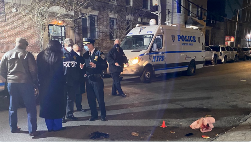 The 11-month-old child’s bloodstained coat lies on the ground surrounded by police markers, as Mayor Eric Adams speaks to police officers (Eric Adams/Twitter)