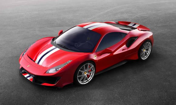 A 488 Pista, a two-seat, mid-engined sports car in red with black and white racing stripes, viewed from above.