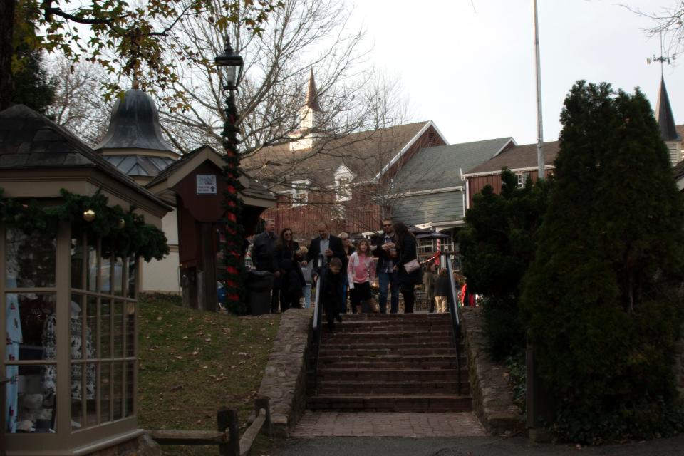 Visitors browse through Peddler's Village in Lahaska on Wednesday, Dec. 1, 2021. 