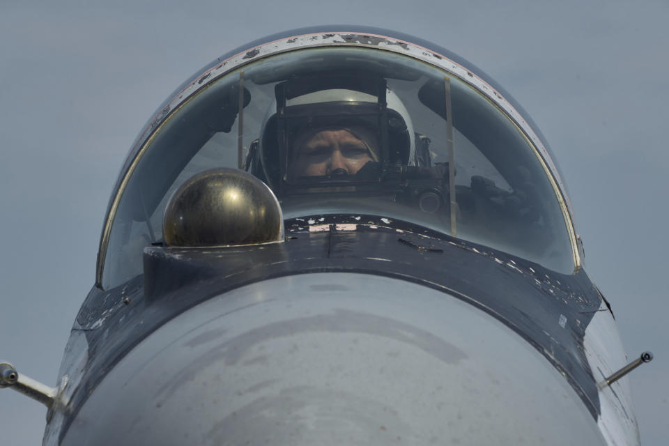 A pilot of Mig-29 fighter of the Ukrainian air force is seen before a mission in Ukraine's war-hit east Wednesday, Aug. 2, 2023. (AP Photo/Libkos)