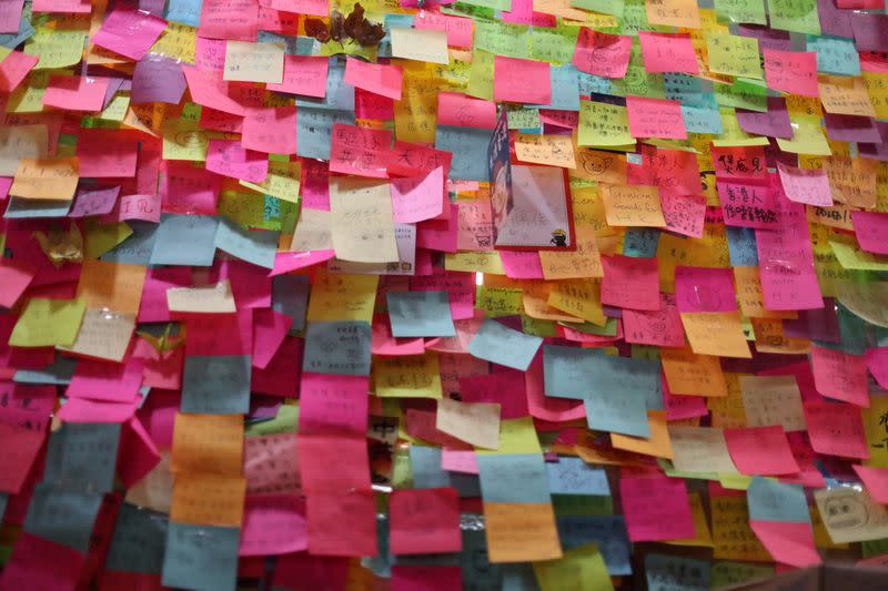 Post-it notes cover the front of a local restaurant offering protesters free Christmas dinner in Hong Kong