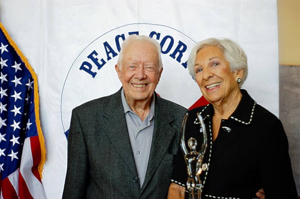 Former President Jimmy Carter poses with Leita Kaldi Davis, who received the 2017 Lillian Carter Award during a ceremony at the Carter Center in Atlanta, Georgia.