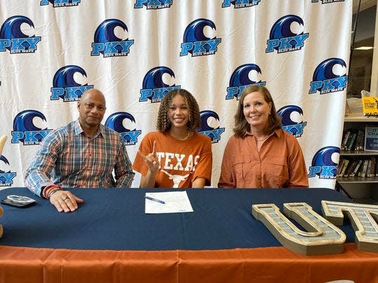 PK Yonge swimmer Lillian Nesty sits with her parents, Anthony and Diane Nesty, after her commitment to Texas at PK Yonge Developmental School on November 9, 2023. Lillian is a three-time state champion and will compete in the Olympic Trials next summer