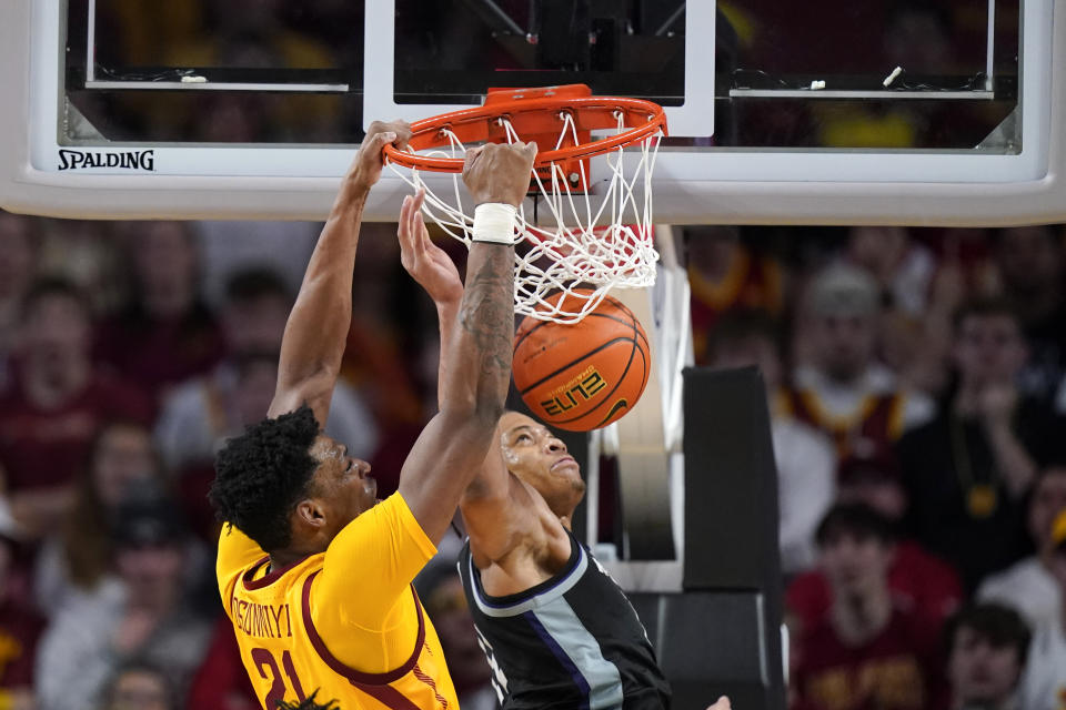 Iowa State center Osun Osunniyi (21) dunks the ball over Kansas State forward Keyontae Johnson during the second half of an NCAA college basketball game, Tuesday, Jan. 24, 2023, in Ames, Iowa. (AP Photo/Charlie Neibergall)