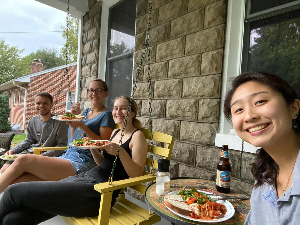 The author (right) having dinner with her housemates on the porch in Carlisle, Penn.<span class="copyright">Courtesy Jimin Kang</span>