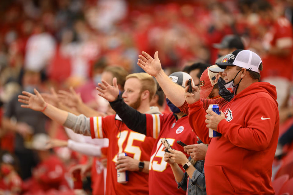 FILE - In this Oct. 5, 2020, file photo, Kansas City Chiefs fans do "the chop" at the start of the team's NFL football game against the New England Patriots in Kansas City, Mo. The Chiefs barred headdresses and war paint amid the nationwide push for racial justice, but its effort to make its popular “war chant” more palatable is getting a fresh round of scrutiny from Native American groups as the team prepares to make its second straight Super Bowl appearance. (AP Photo/Reed Hoffmann, File)