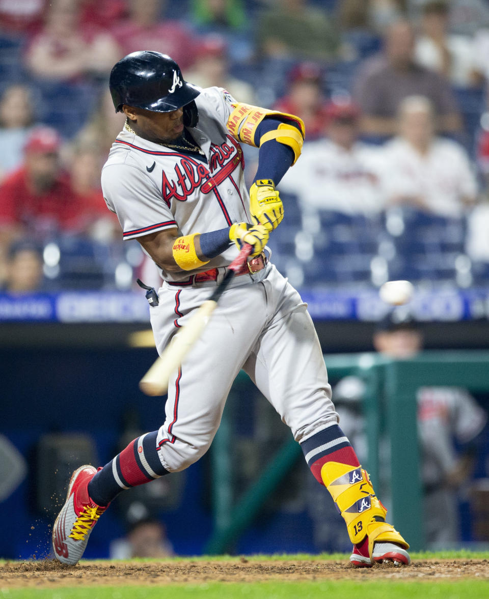 Atlanta Braves' Ronald Acuna Jr. hits a two-run single during the eighth inning of the team's baseball game against the Philadelphia Phillies, Tuesday, June 8, 2021, in Philadelphia. (AP Photo/Laurence Kesterson)