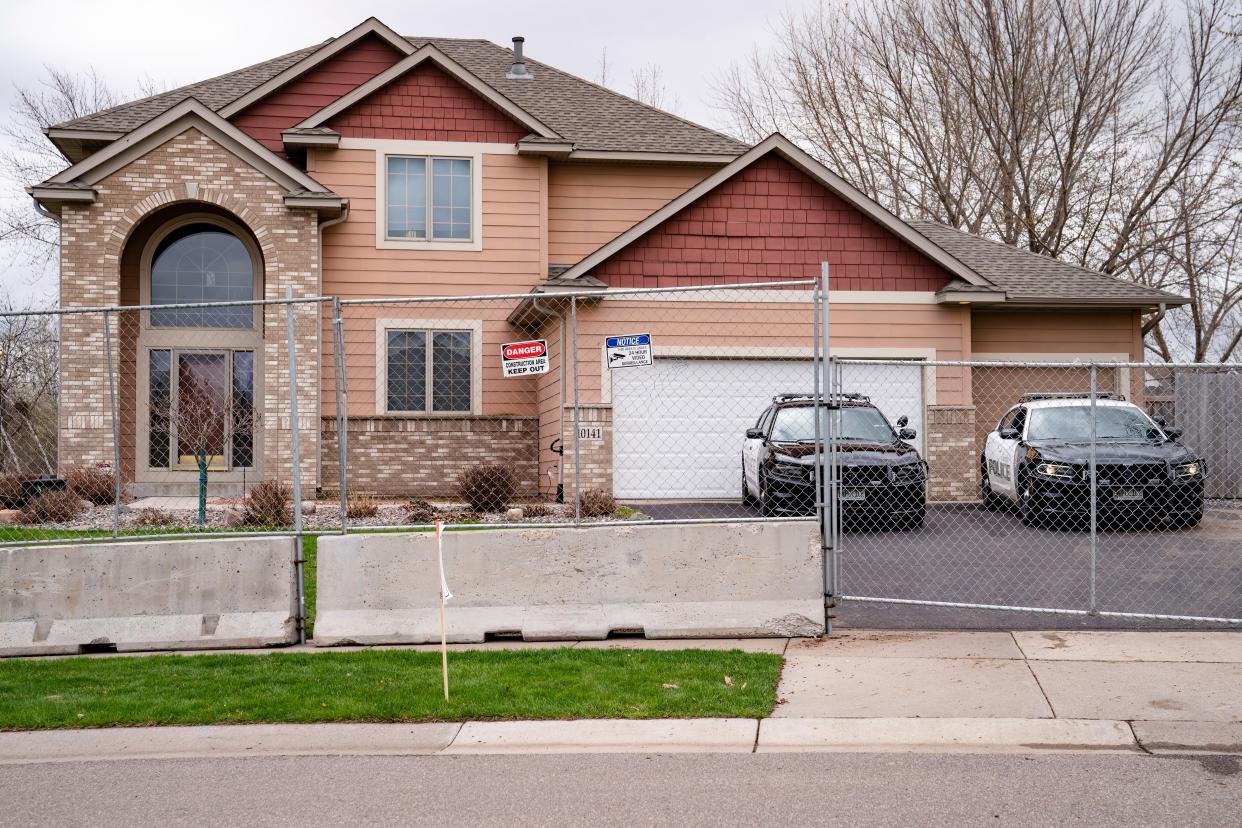 Fencing and concrete barriers surround the home of former Brooklyn Center police officer Kim Potter as local police guard her residence on Wednesday, April 14, 2021, in Champlin, Minn. A prosecutor said Wednesday that he will charge Potter, a white former suburban Minneapolis police officer with second-degree manslaughter for killing 20-year-old Black motorist Daunte Wright in a shooting that ignited days of unrest and clashes between protesters and police.