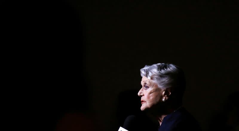 Actress Lansbury, who voiced the character of Mrs. Potts, is interviewed as she arrives for the 25th anniversary celebration of "Beauty and the Beast" at the Academy of Motion Picture Arts and Sciences in Beverly Hills