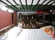 Female soldiers Zarmina Ahmadi, 22 (L), Adela Haidari, 23 (C), and Sabera, 21 (R), from the Afghan National Army (ANA) rest in their barracks at the Kabul Military Training Centre (KMTC) in Kabul, Afghanistan October 26, 2016. REUTERS/Mohammad Ismail