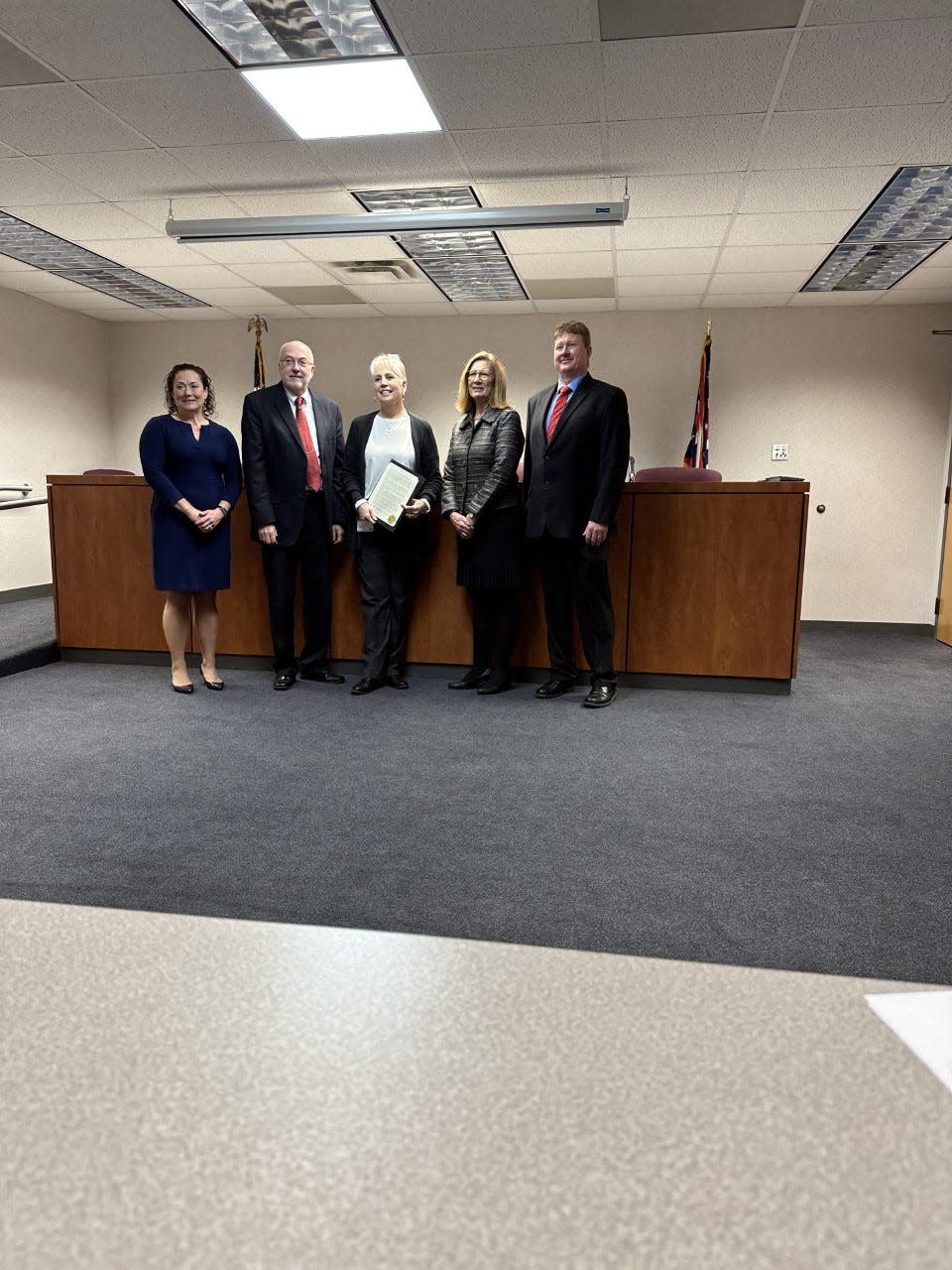 Gayle Byrne of the Anti-Human Trafficking Coalition representing Wayne, Ashland and Holmes counties, center, receives a proclamation Wednesday recognizing January as Human Trafficking Awareness Month from Commissioners Ron Amstutz, Sue A. Smail and Jonathan Hofstetter. At far left is county Prosecutor Angela Wypasek.