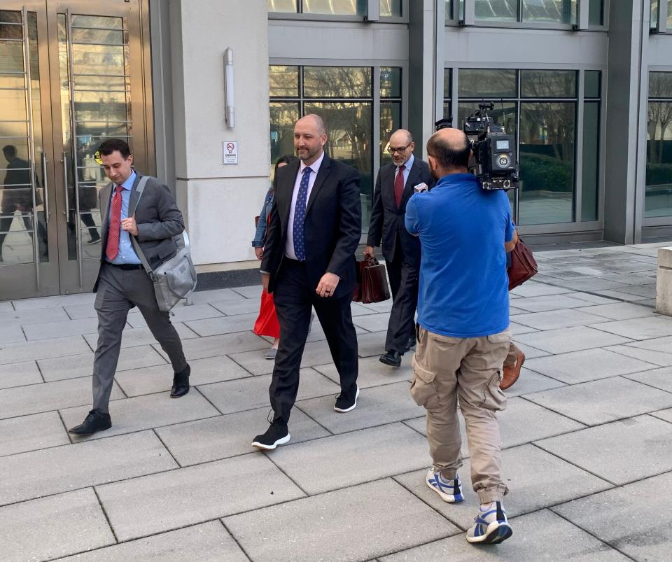Ryann Wannemacher, at center, leaves the federal courthouse with his attorneys on Feb. 28, 2024. Wannemacher, former chief financial officer of JEA, stood trial on charges of conspiracy and fraud.