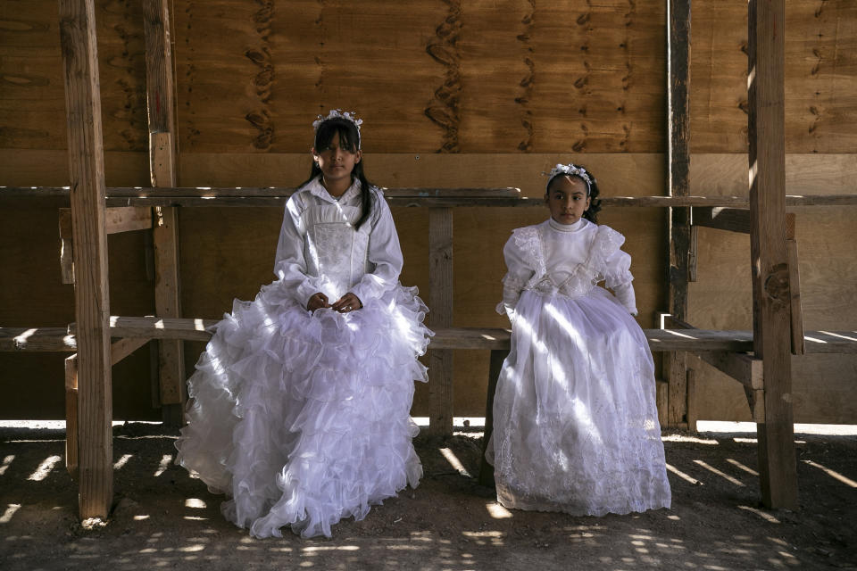 Villagers wearing costumes take part in a Holy Thursday celebration in Santa Rosalia, in the municipality of Mulege, Baja California Sur state, Mexico, Thursday, April 6, 2023. (AP Photo/Emilio Espejel)