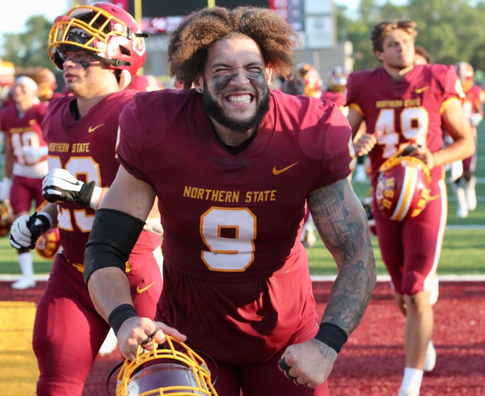 Northern State University defensive lineman Ian Marshall flexes while heading to the locker room at halftime of the Sept. 1 game against Upper Iowa at Dacotah Bank Stadium. Saturday, the Wolves host Minnesota State, Mankato at 6 p.m.