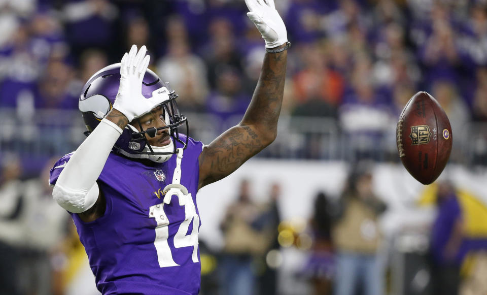 Minnesota Vikings wide receiver Stefon Diggs (14) celebrates after catching a pass for a first down during the second half of the team's NFL football game against the Green Bay Packers, Sunday, Nov. 25, 2018, in Minneapolis. The Vikings won 24-17. (AP Photo/Bruce Kluckhohn)