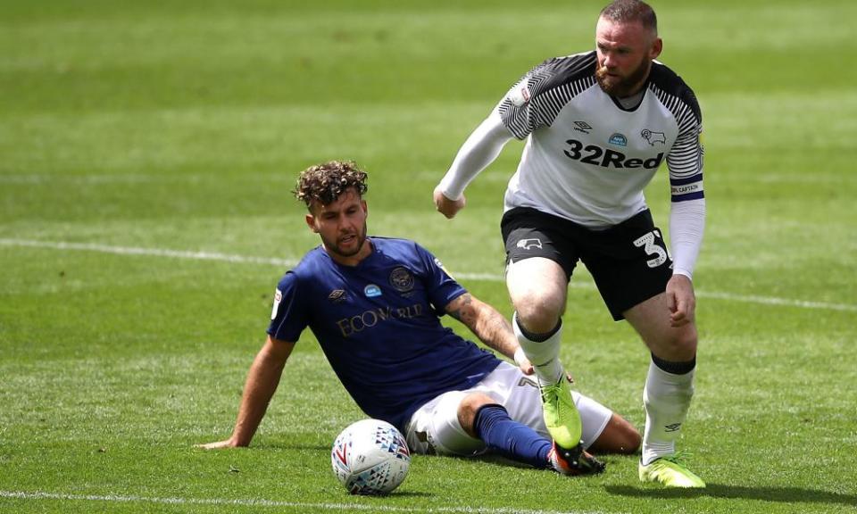 Derby County’s Wayne Rooney (right) skips beyond the challenge of Brentford’s Emiliano Marcondes during his side’s 3-1 defeat.
