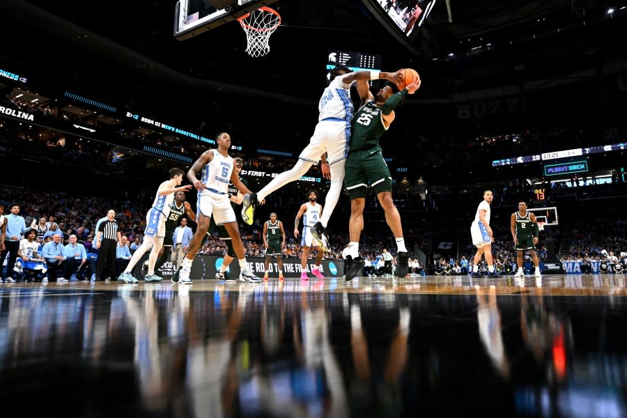 CHARLOTTE, NORTH CAROLINA – MARCH 23: Jae’Lyn Withers #24 of the North Carolina Tar Heels defends Malik Hall #25 of the Michigan State Spartans during the first half of the second round of the NCAA Men’s Basketball Tournament at Spectrum Center on March 23, 2024 in Charlotte, North Carolina. (Photo by Grant Halverson/NCAA Photos via Getty Images)