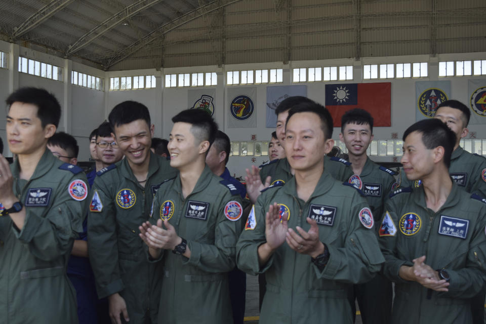 Taiwanese airmen applaud as they listen to Taiwan President Tsai Ing-wen speak during her visit to the Penghu Magong military air base in outlying Penghu Island, Taiwan Tuesday, Sept. 22, 2020. Tsai visited the military base on one of Taiwan’s outlying islands Tuesday in a display of resolve following a recent show of force by rival China. (AP Photo/Wu Huizhong)