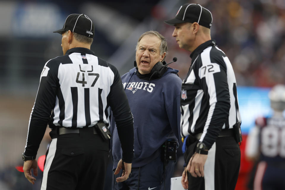 New England Patriots Bill Belichick, center, speaks with officials during the first half of an NFL football game against the Kansas City Chiefs, Sunday, Dec. 17, 2023, in Foxborough, Mass. (AP Photo/Michael Dwyer)