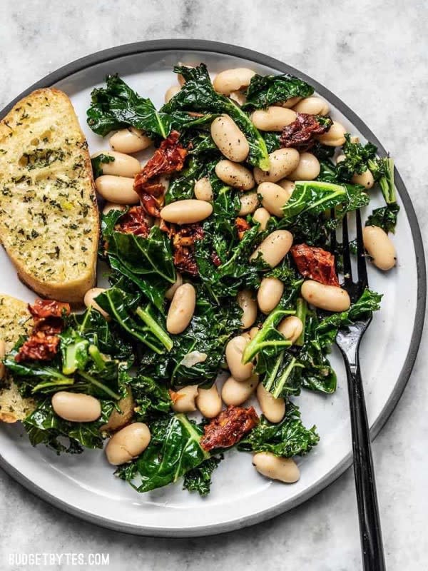 <p>Budget Bytes</p><p>This quick sun dried tomato, kale, and white bean skillet is a fast, flavorful, and fiber-licious meal that is ready for perfect for weekly meal prepping.</p><p><strong>Get the recipe: <a href="https://www.budgetbytes.com/sun-dried-tomato-kale-and-white-bean-skillet/" rel="nofollow noopener" target="_blank" data-ylk="slk:Sun Dried Tomato Kale and White Bean Skillet;elm:context_link;itc:0;sec:content-canvas" class="link rapid-noclick-resp"><em>Sun Dried Tomato Kale and White Bean Skillet</em></a></strong></p>
