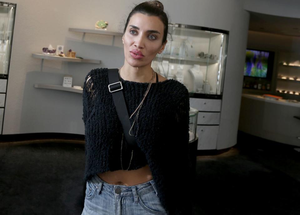 A woman standing in an upscale jewelry store