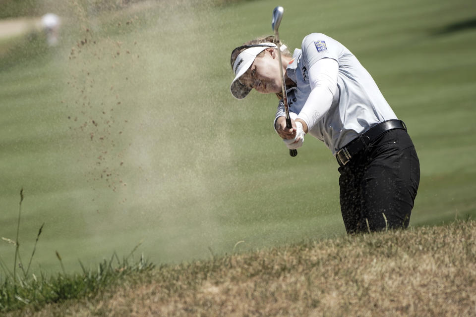 FILE - Brooke Henderson, of Canada, follows her ball after playing on the 5th hole during the last round of the Evian Championship women's golf tournament in Evian, eastern France, on July 24, 2022. The LPGA's final major of the year might be the most significant based on where it's played. The Women's British Open goes to Muirfield. It was only six years ago Muirfield had an all-male membership. In danger of losing the British Open, the club took another vote and now allows women. And now it hosts the Women's British Open. (AP Photo/Laurent Cipriani)