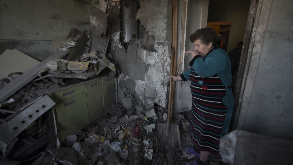 A woman stands among the rubble in her apartment hit by shelling in Donetsk, Russian-controlled Ukraine, on April 2. - Stringer/AFP/Getty Images