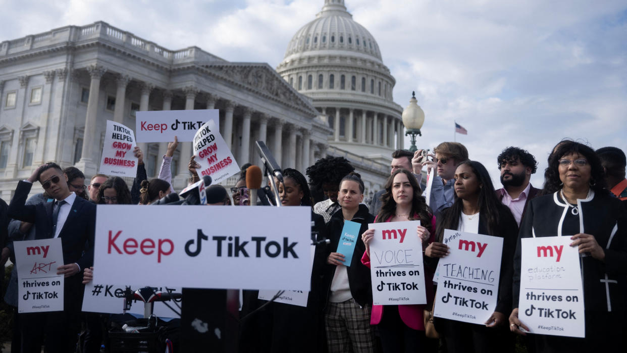  People gather for a press conference about their opposition to a TikTok ban on Capitol Hill in Washington, DC. 