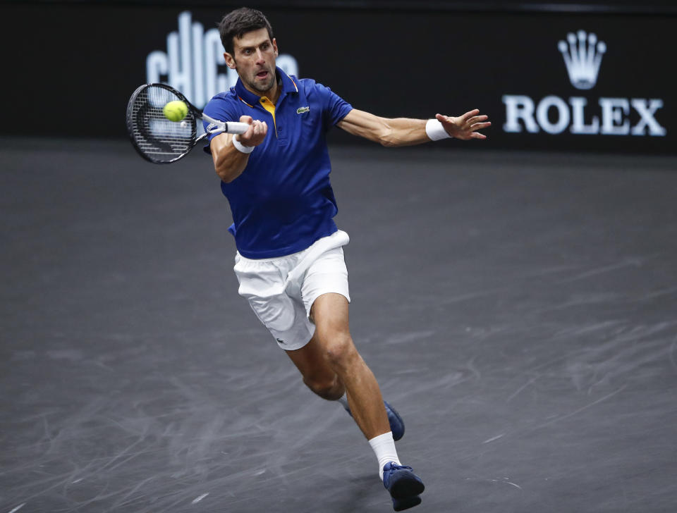 Team Europe's Novak Djokovic hits a return to Team World's Kevin Anderson at the Laver Cup tennis event, Saturday, Sept. 22, 2018, in Chicago. (AP Photo/Kamil Krzaczynski)