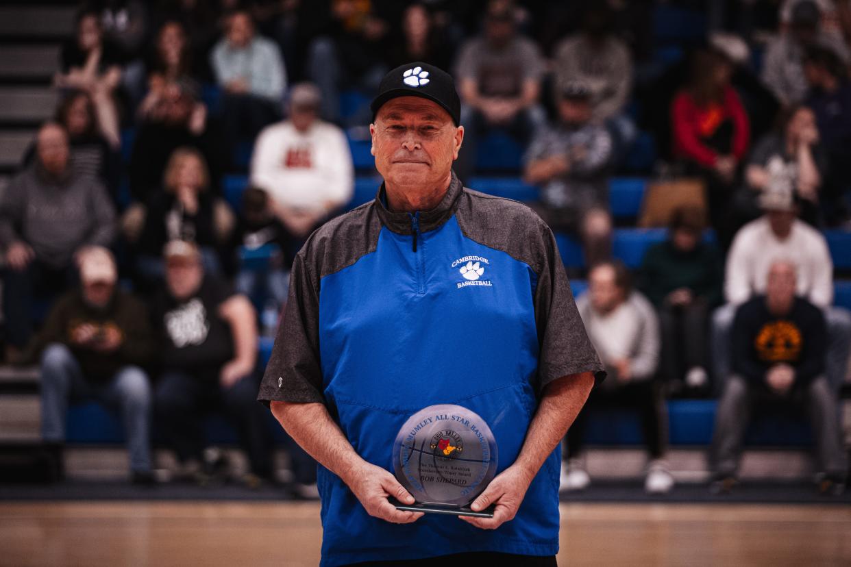 Cambridge head softball coach Bob Shepard received the Thomas Rataiczak Scorekeeper/Timer Award from the Ohio Valley Athletic Conference on Sunday during the OVAC Samuel A. Mumley All-Star Basketball Games Sunday inside the ‘Palace on the Hill’ at Wheeling Park High School. Shepard was recognized for his work as scorekeeper for both the Cambridge boys and girls basketball programs, along with volleyball clock operator. In addition, Shepard has guided the Bobcats softball program currently in his 22nd season. Shepard has also coached middle school football and served as Cambridge Football Booster Club president.