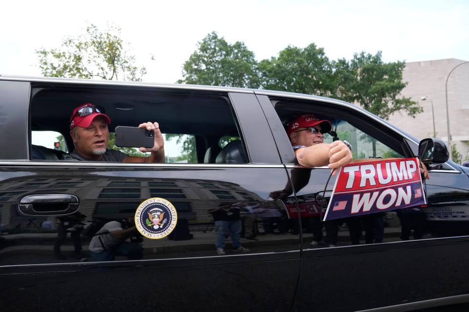 Supporters of Former President Donald Trump are seen near the courthouse ahead of his arraignment on four charges related to the 2020 election.