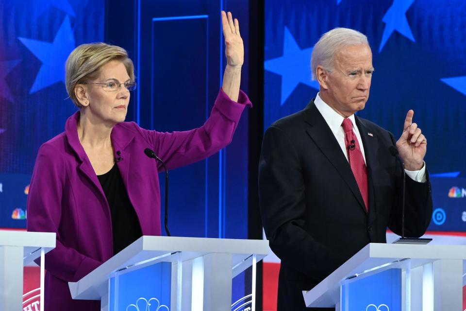 Democratic presidential hopefuls Massachusetts Senator Elizabeth Warren and former Vice President Joe Biden participate in the fifth Democratic primary debate of the 2020 presidential campaign season, co-hosted by MSNBC and The Washington Post at Tyler Perry Studios in Atlanta, Georgia on November 20, 2019.