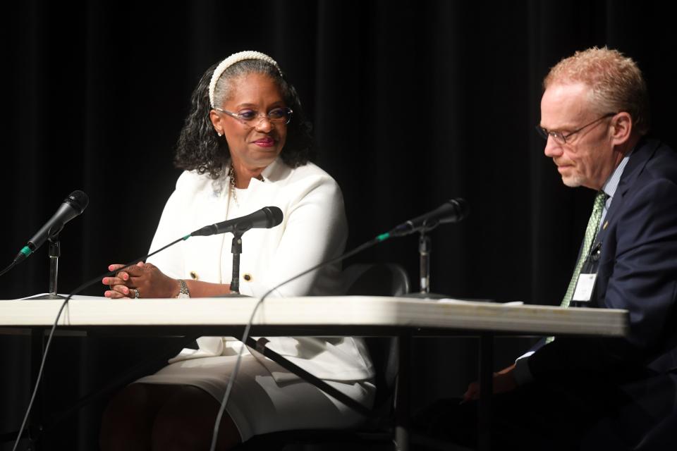 Finalist Aretha Ferrell-Benavides listens to a question during a public forum with the two candidates for Oak Ridge city manager, in Oak Ridge High School’s auditorium, Wednesday, Aug. 16, 2023. W. Lane Bailey, senior vice president for GovHR USA is at the right.