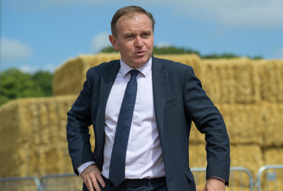 EXETER, ENGLAND - JULY 02: George Eustice, Secretary of State for Environment, is shown around during his visit to the 125th Devon County Show at the Westpoint Arena and Showground in Clyst St Mary near Exeter on July 02, 2021 in Devon, England. Established in 1872 it has grown into one of the South West's biggest county shows. Although primarily an agricultural livestock and produce showcase, it is also seen as a barometer for the health of the whole agricultural industry in general. The Show organisers are ensuring it is a Covid Secure event and is being staged predominantly outdoors. Social distancing will be managed by a team of Covid Marshalls brought in specially for the event. (Photo by Finnbarr Webster/Getty Images)