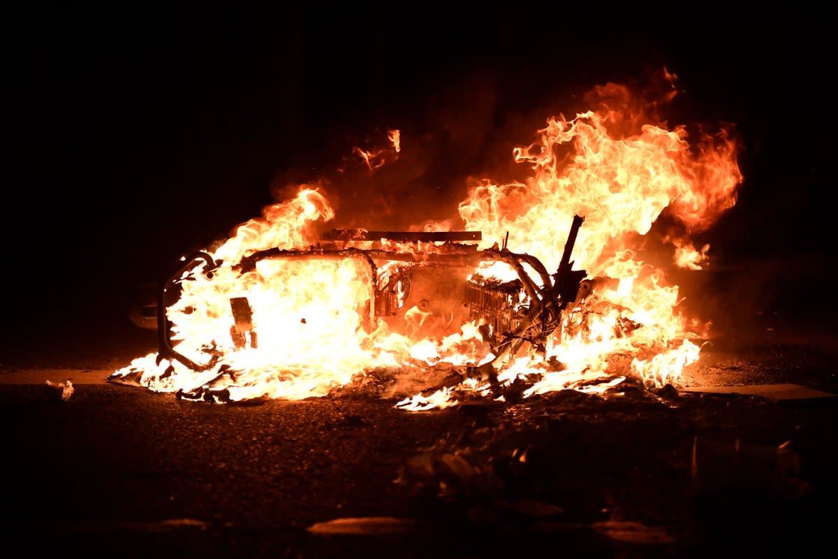 A scooter burns after being set alight by demonstrators (AFP/Getty)