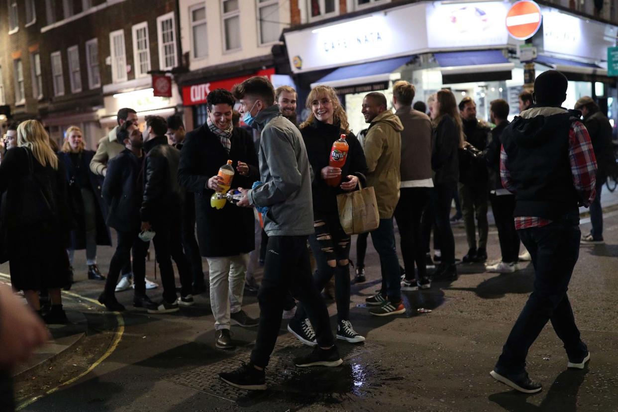 People in Soho, London, after pubs and restaurants were subject to a 10pm curfew to combat the rise in coronavirus cases in England: PA