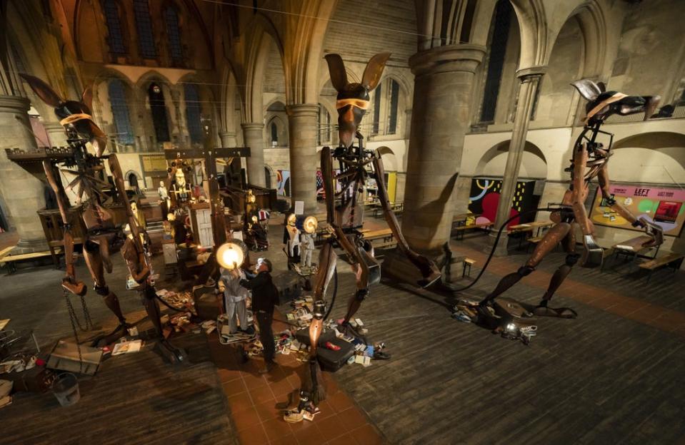 Artist Giles Walker puts the finishing touches to his installation Monster (Danny Lawson/PA) (PA Wire)